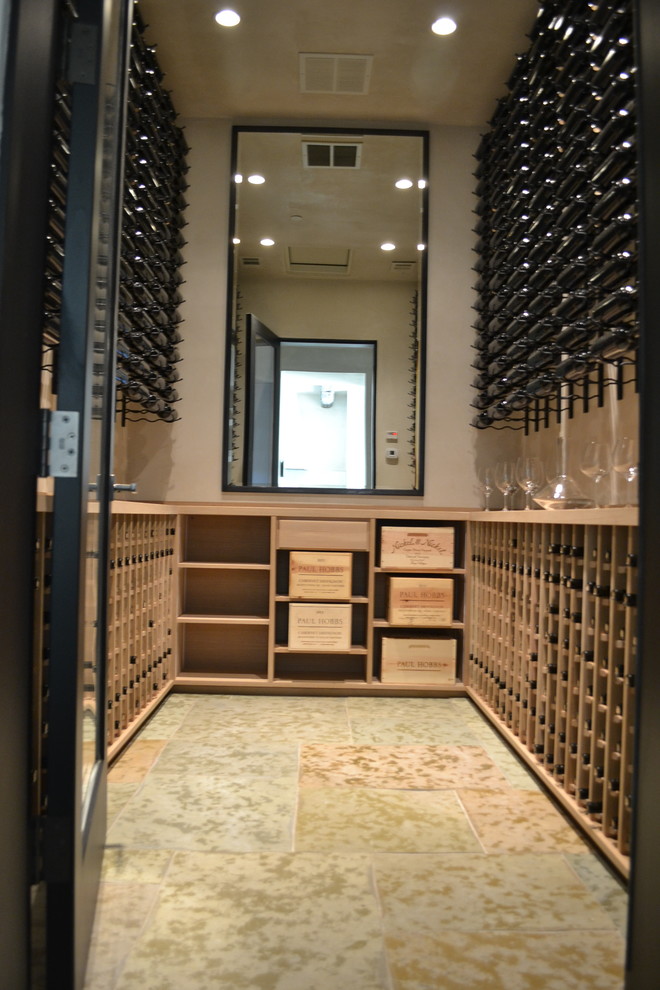 Design ideas for a large modern wine cellar in San Francisco with travertine flooring and storage racks.