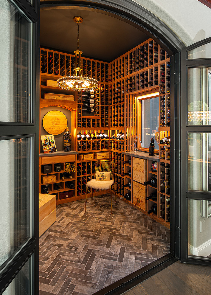 Small transitional porcelain tile and gray floor wine cellar photo in Sacramento with storage racks