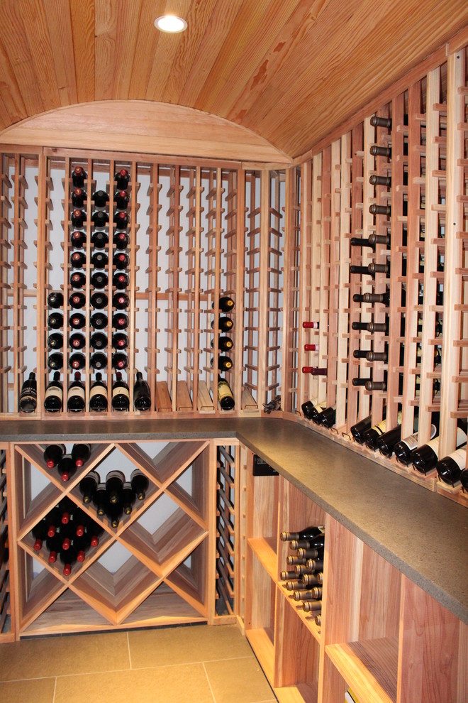 Design ideas for a medium sized classic wine cellar in New York with ceramic flooring and display racks.