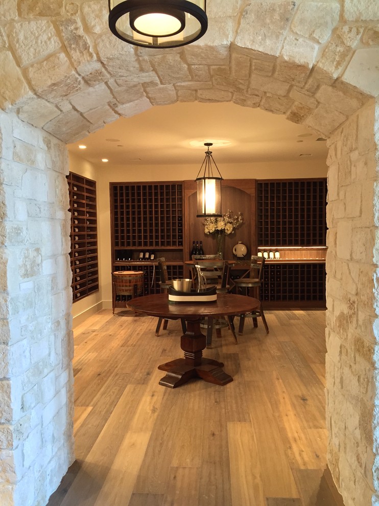 Inspiration for a large rustic medium tone wood floor wine cellar remodel in San Francisco with storage racks