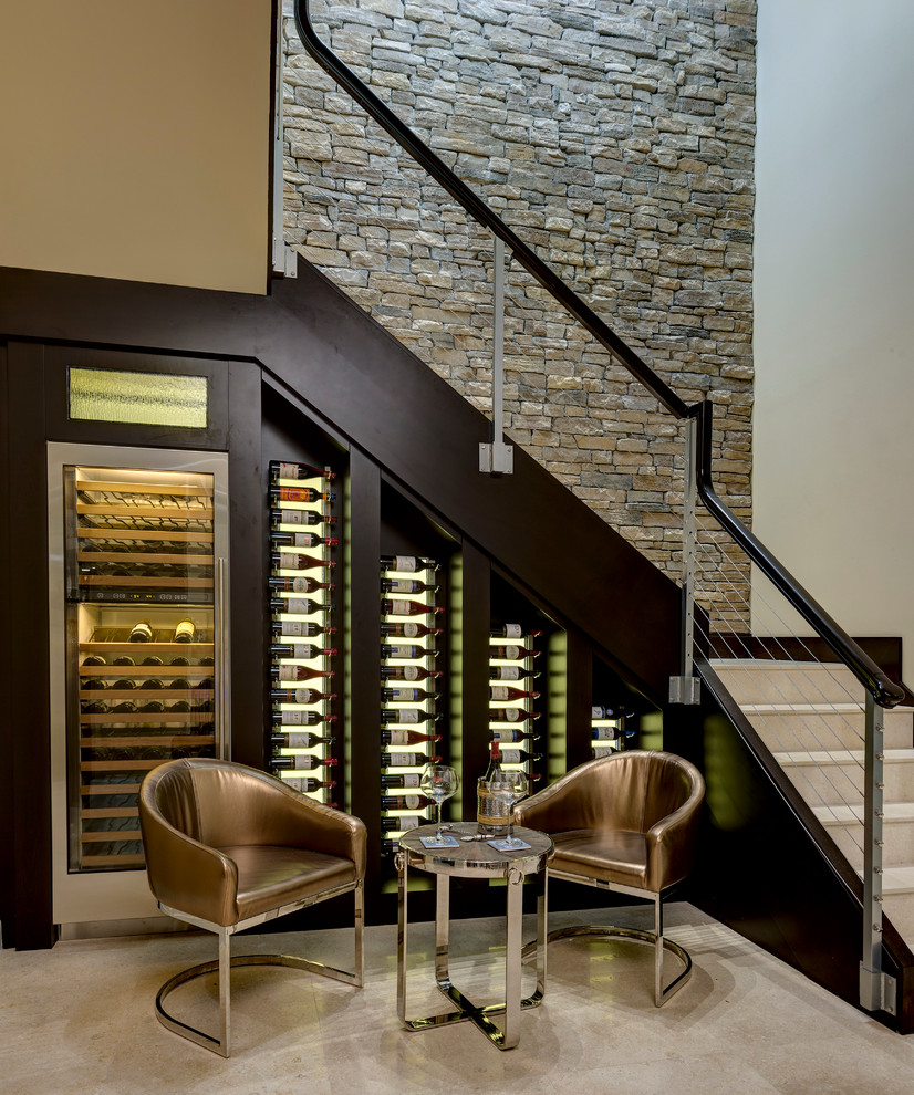 Small classic wine cellar in Orlando with display racks and beige floors.