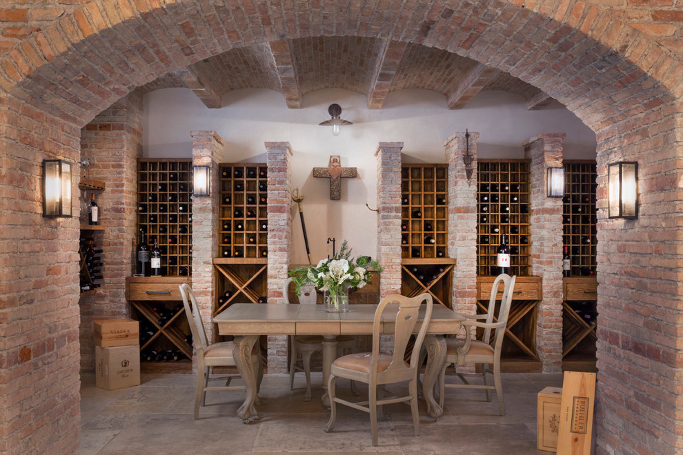 Design ideas for a large mediterranean wine cellar in Orange County with storage racks.