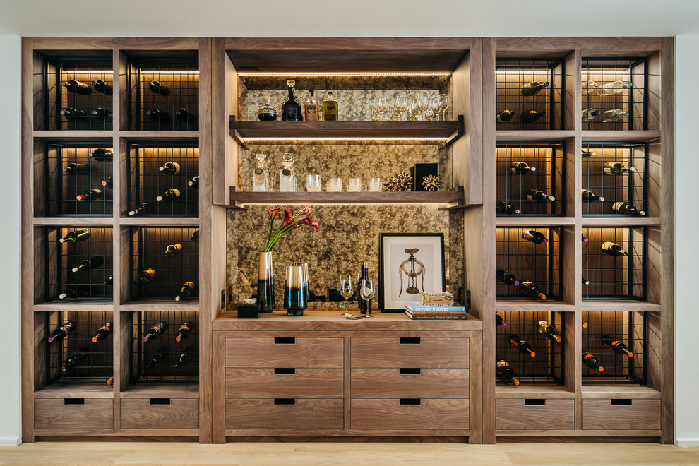 Design ideas for a contemporary wine cellar in San Francisco with light hardwood flooring and storage racks.