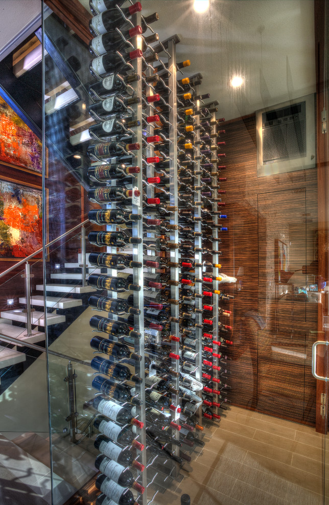 Design ideas for a small modern wine cellar in Tampa with porcelain flooring and storage racks.