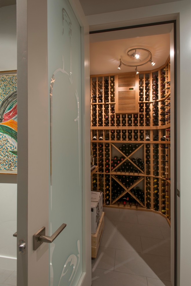This is an example of a contemporary wine cellar in Other.