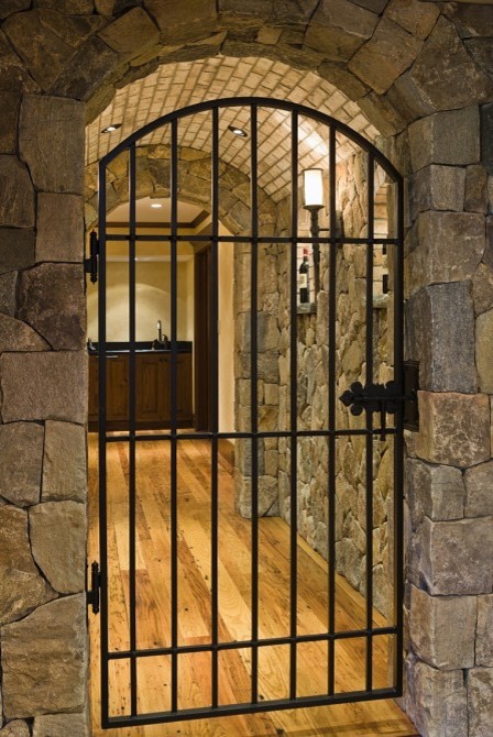 Inspiration for a large traditional wine cellar in Boston with medium hardwood flooring and display racks.
