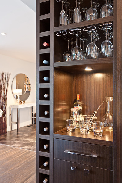 Inspiration for a small contemporary wine cellar in Vancouver with dark hardwood flooring and storage racks.