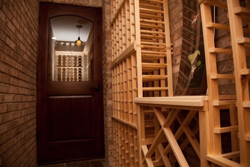 Mid-sized slate floor wine cellar photo in Chicago with storage racks