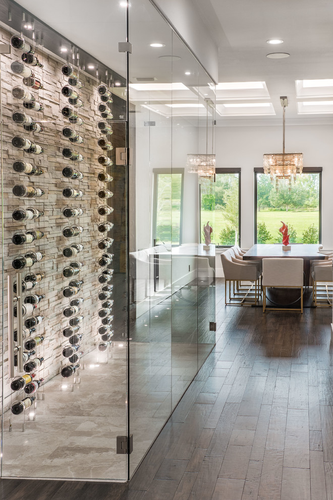 Inspiration for a small contemporary wine cellar in Tampa with beige floors and display racks.