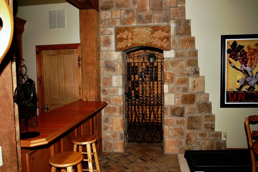 Example of a tuscan wine cellar design in Other