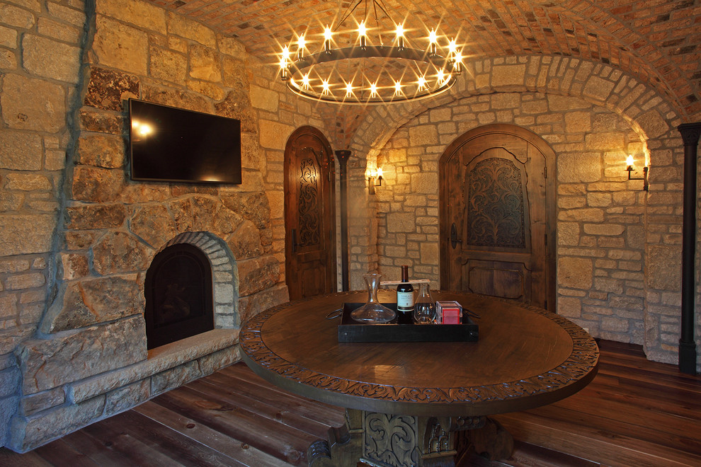 Mid-sized mountain style dark wood floor wine cellar photo in Minneapolis