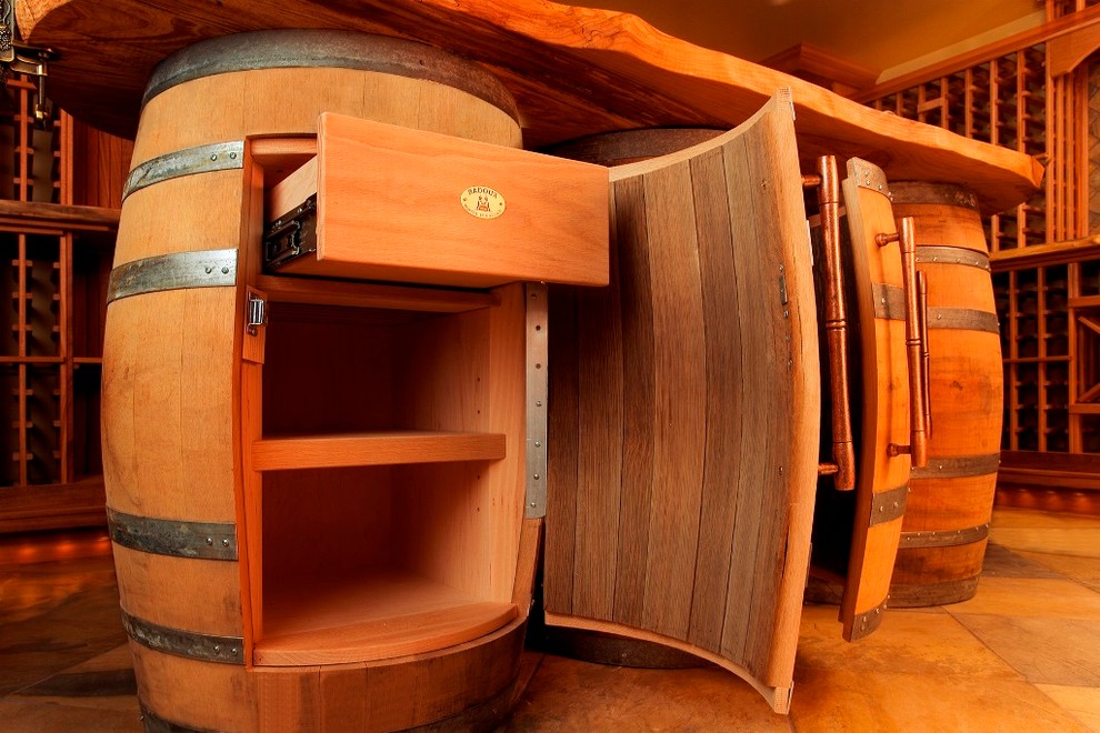 Inspiration for a large rustic slate floor wine cellar remodel in Seattle with storage racks