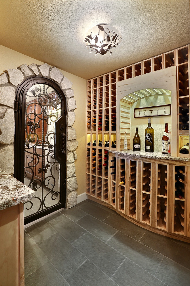 Inspiration for a mediterranean wine cellar remodel in Denver