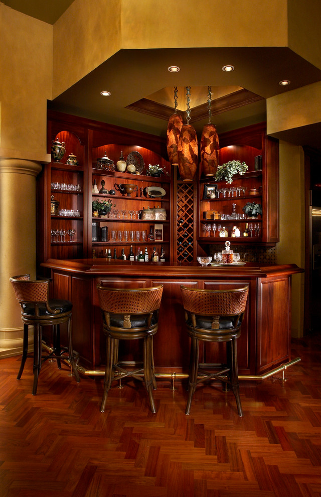 Design ideas for a medium sized traditional home bar in Tampa with dark hardwood flooring.