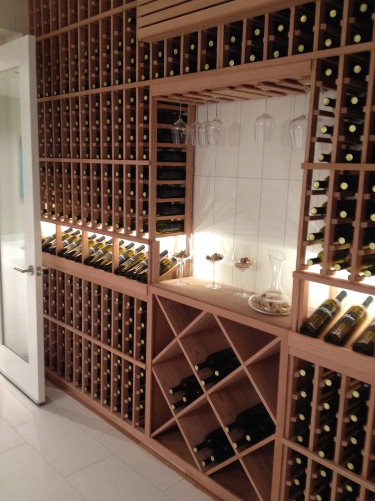 Design ideas for a medium sized contemporary wine cellar in Orange County with travertine flooring and storage racks.