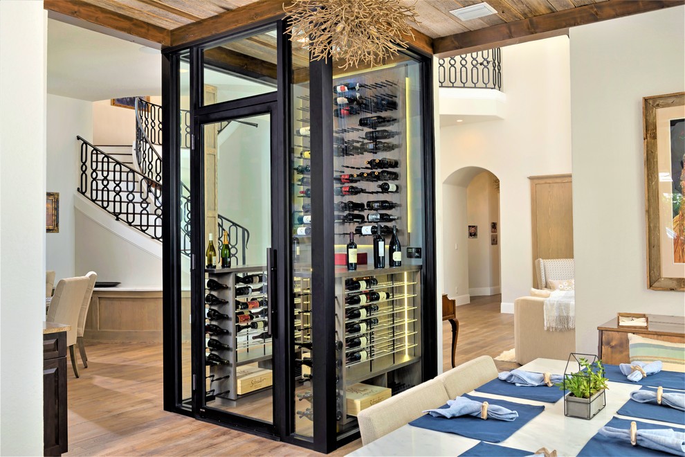 This is an example of a medium sized contemporary wine cellar in Orlando.