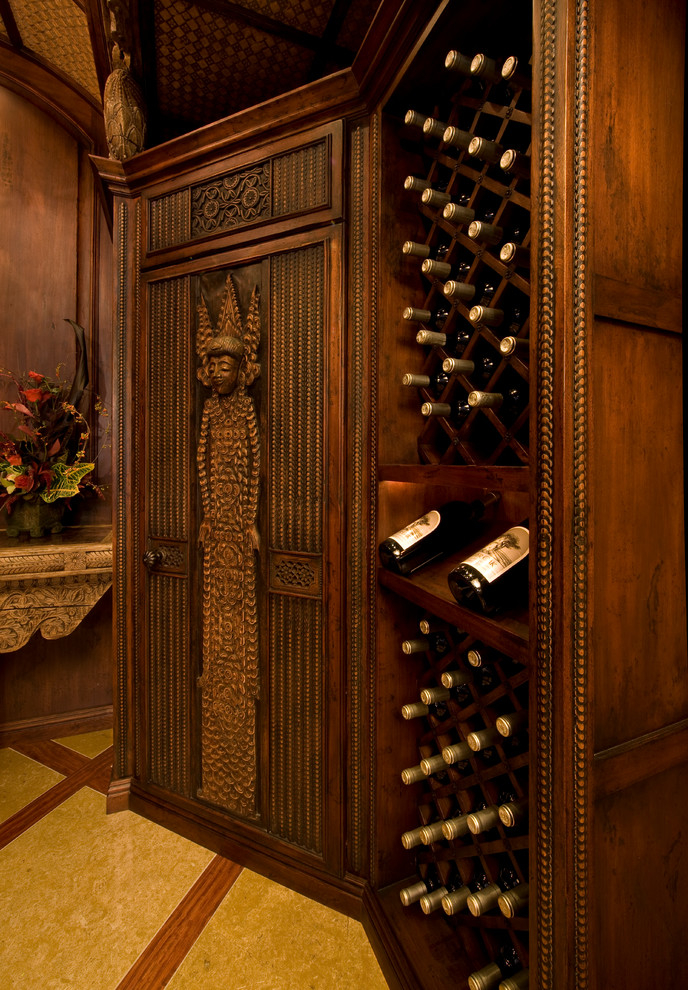 Design ideas for a world-inspired wine cellar in San Diego with storage racks.