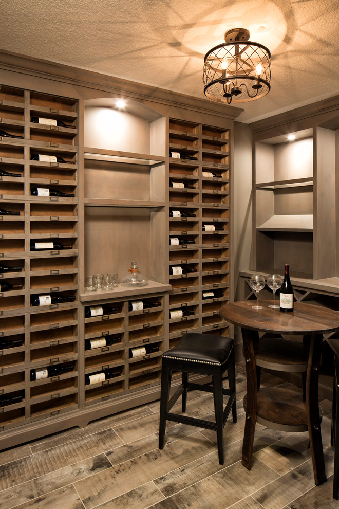 Design ideas for a large traditional wine cellar in Minneapolis with vinyl flooring.
