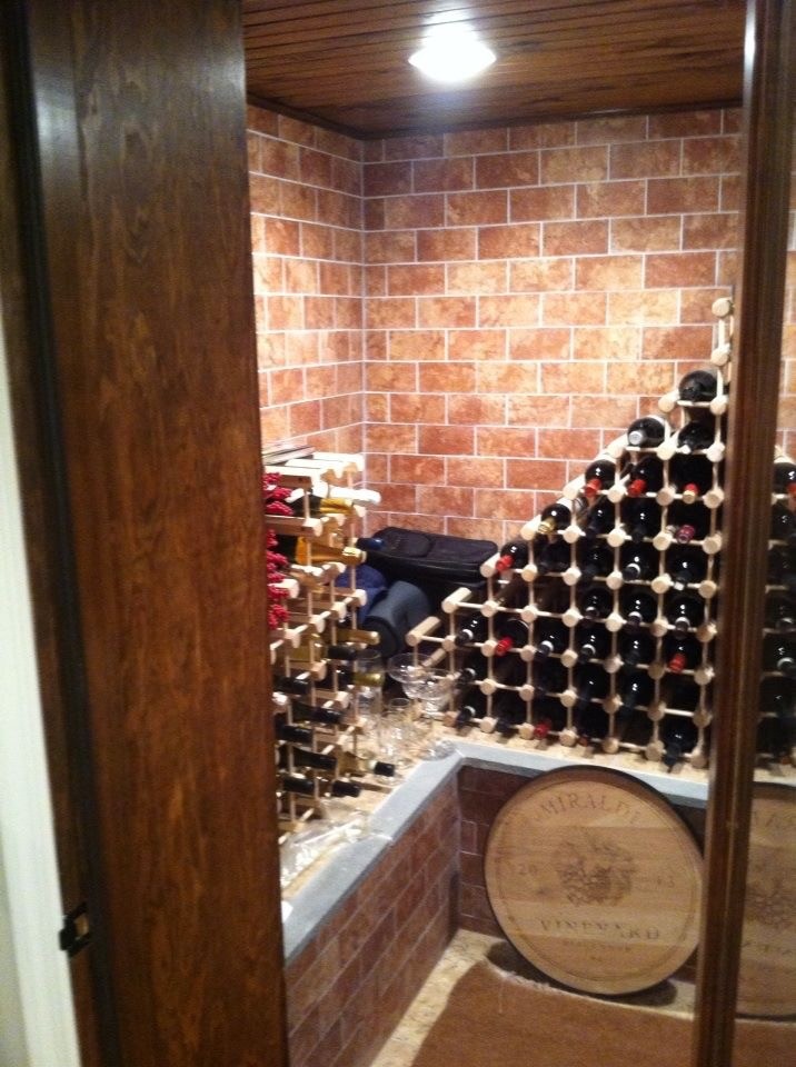 Medium sized traditional wine cellar in New York with storage racks.