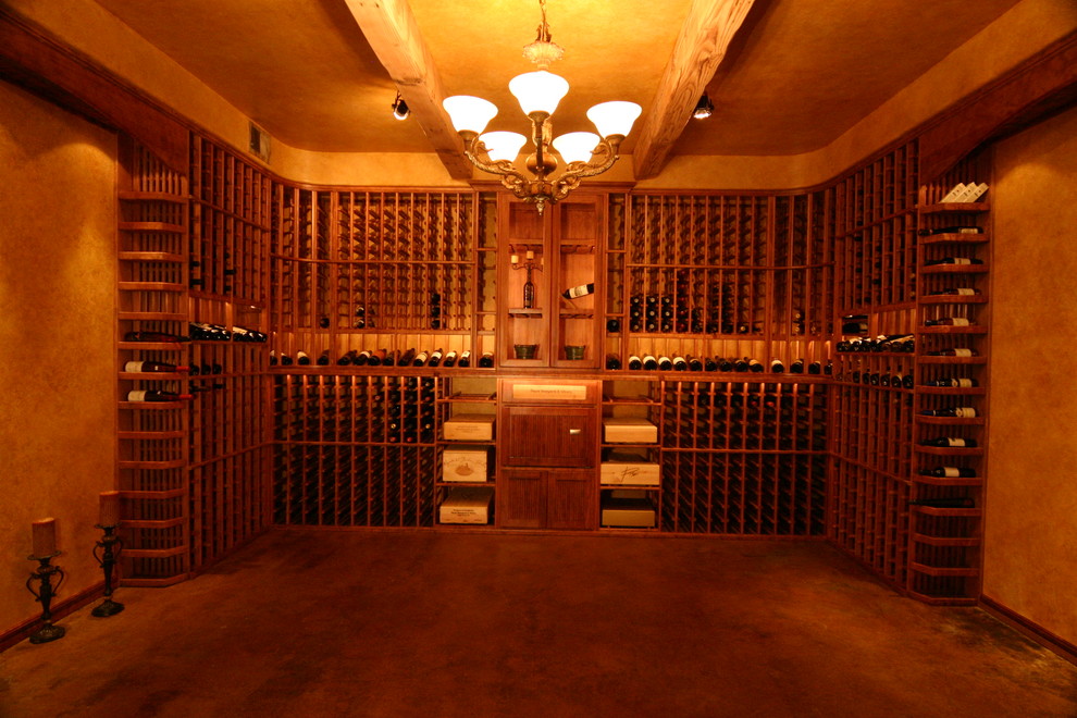 Photo of a medium sized traditional wine cellar in Sacramento with ceramic flooring, storage racks and grey floors.
