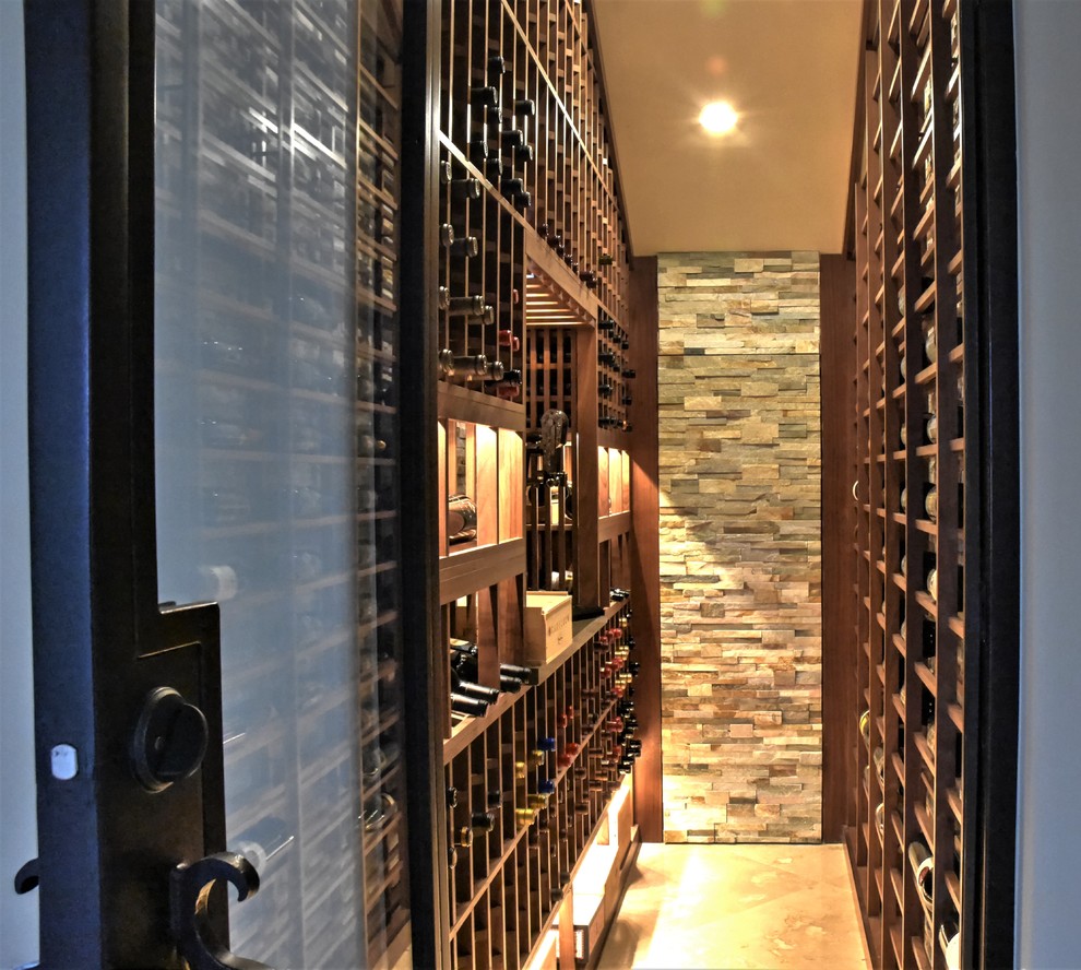 Inspiration for a medium sized traditional wine cellar in Los Angeles with terracotta flooring and display racks.