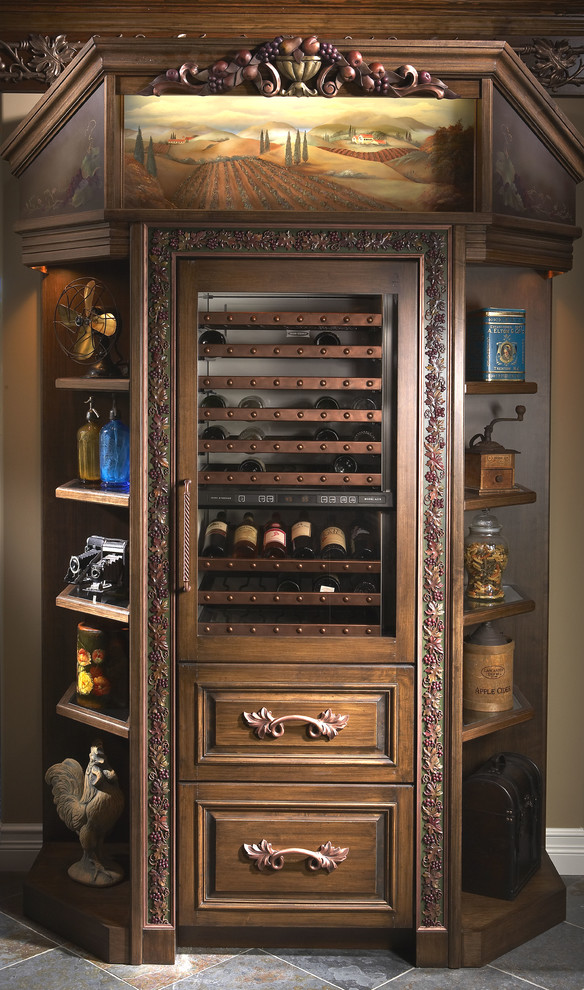 This is an example of a medium sized traditional wine cellar in Miami with slate flooring and display racks.