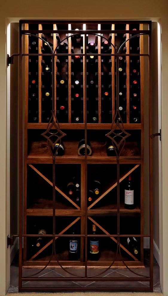 Example of a large classic terra-cotta tile wine cellar design in DC Metro with storage racks