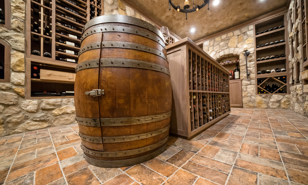Large mountain style porcelain tile and gray floor wine cellar photo in New York with display racks