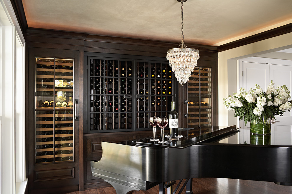 Medium sized classic wine cellar in Minneapolis with dark hardwood flooring and display racks.