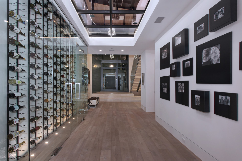 Inspiration for a large contemporary wine cellar in Los Angeles with storage racks.