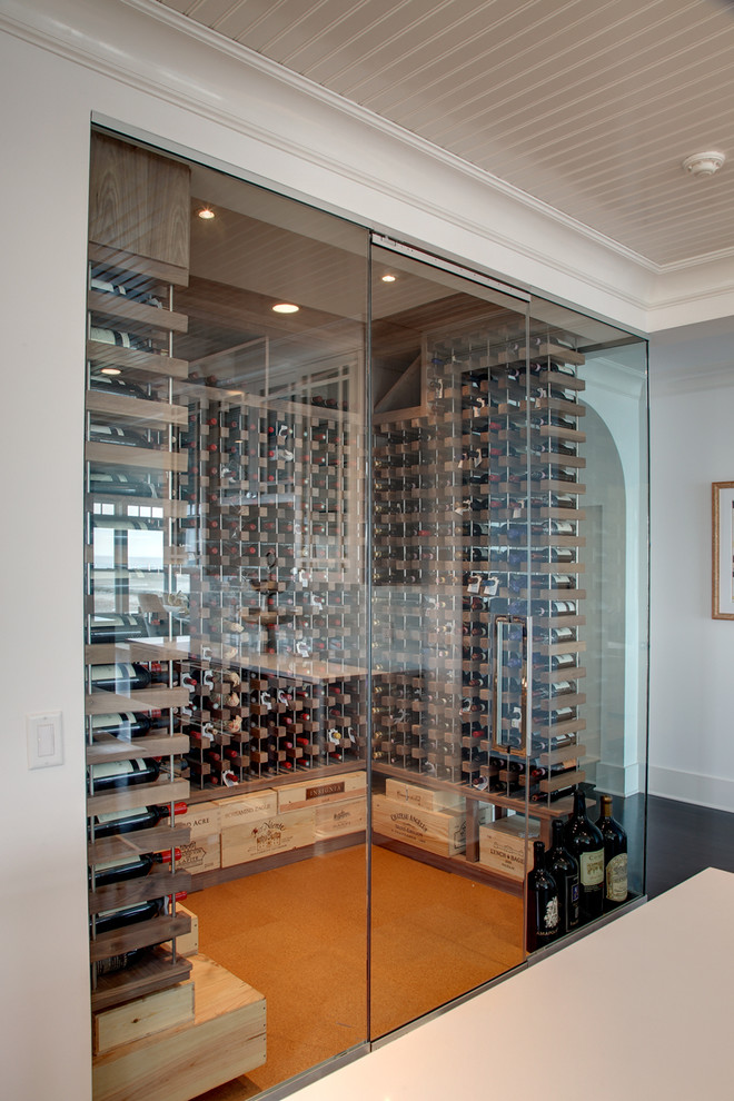 Inspiration for a beach style wine cellar in New York with cork flooring.