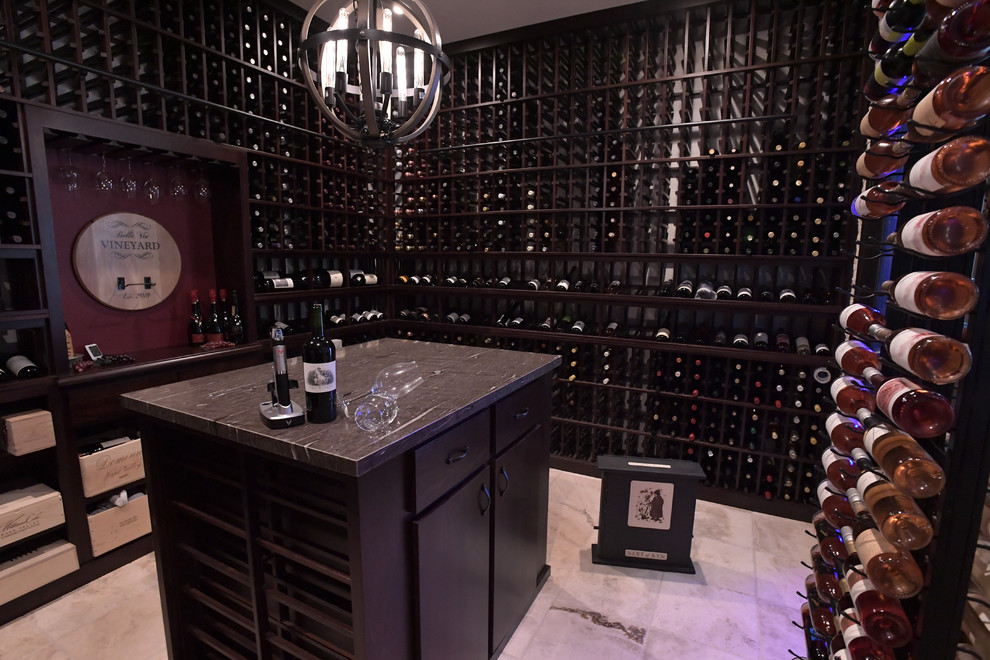 This is an example of a large traditional wine cellar in San Diego with porcelain flooring and display racks.