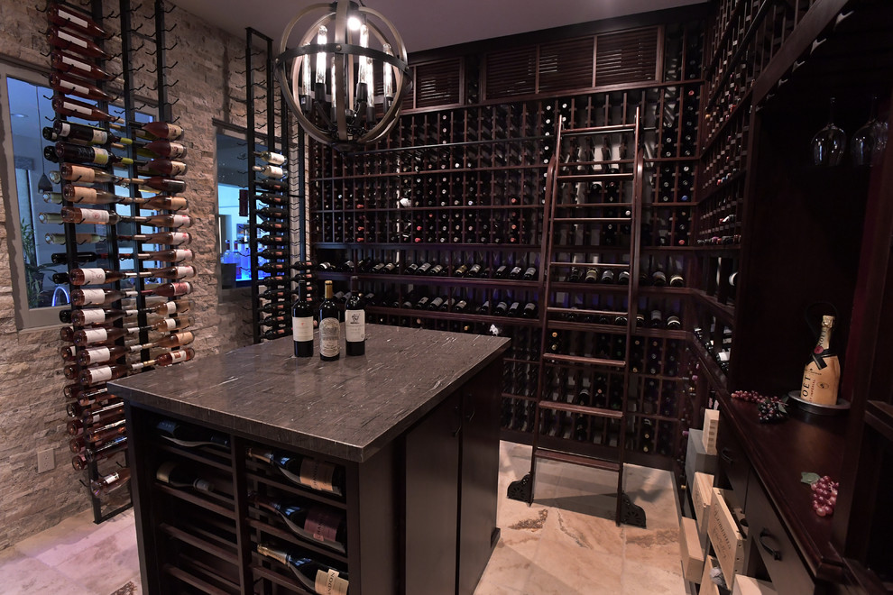 Large elegant porcelain tile wine cellar photo in San Diego with display racks