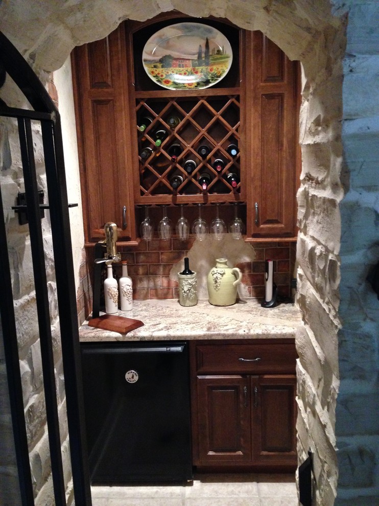 Inspiration for a small rustic wine cellar in Houston with ceramic flooring and cube storage.