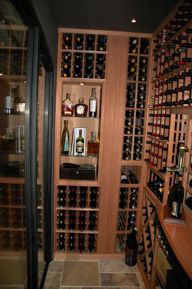 Mid-sized elegant wine cellar photo in San Diego with display racks