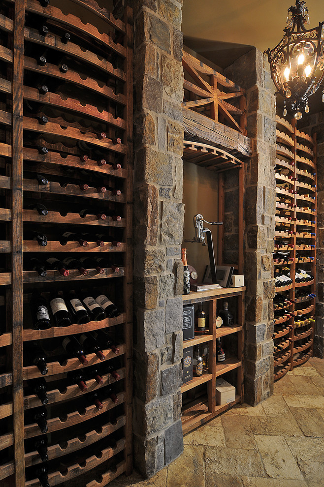 Wine cellar - mid-sized traditional brick floor and beige floor wine cellar idea in Phoenix with storage racks
