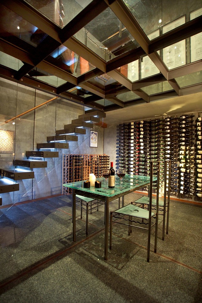 Design ideas for a large urban wine cellar in Dunedin with storage racks.