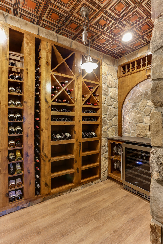 Medium sized rustic wine cellar in Raleigh.