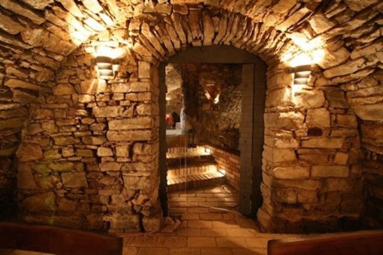 This is an example of a medium sized rustic wine cellar in Nashville.