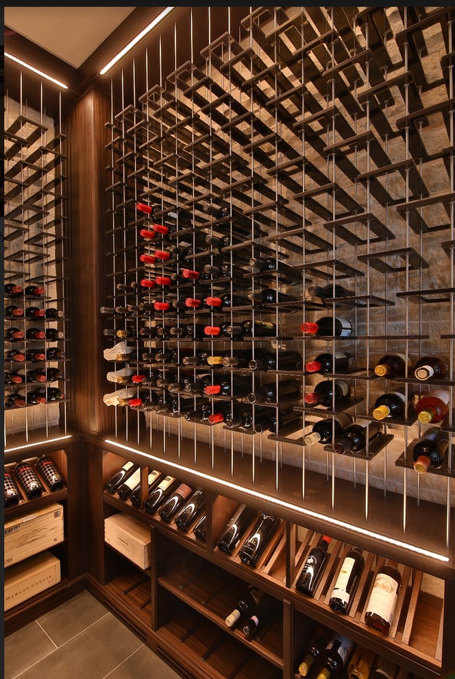Inspiration for a mid-sized transitional porcelain tile and gray floor wine cellar remodel in Dallas with storage racks