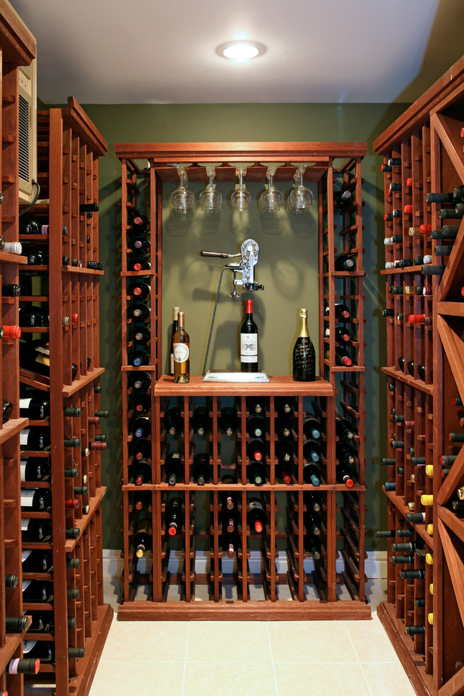 Inspiration for a small traditional wine cellar in New York with ceramic flooring, storage racks and beige floors.