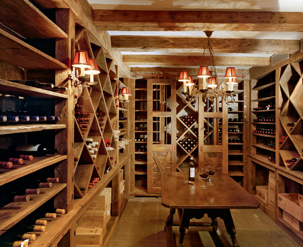 Inspiration for a large rural wine cellar in New York with storage racks, porcelain flooring and brown floors.