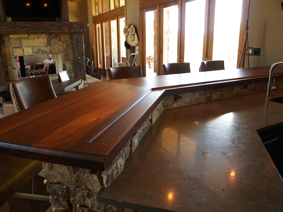 rustic gun room in texas highlights texas walnut wood tops