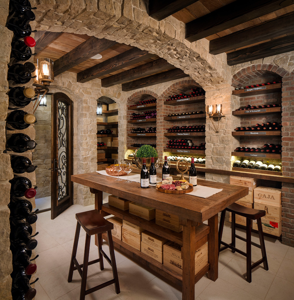 Wine cellar - mid-sized mediterranean porcelain tile wine cellar idea in San Diego with storage racks