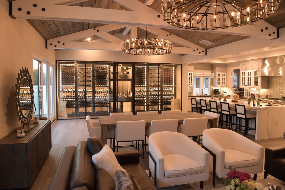 Inspiration for a large contemporary wine cellar in Orange County with medium hardwood flooring, display racks and brown floors.