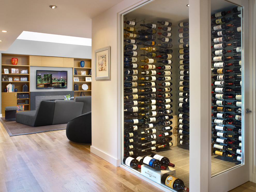 Small modern wine cellar in San Francisco with display racks.