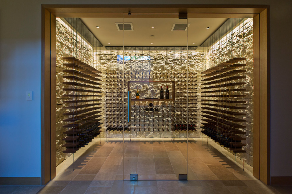 Medium sized contemporary wine cellar in San Francisco with limestone flooring and storage racks.