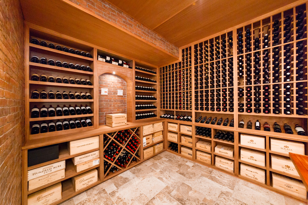 This is an example of a large classic wine cellar in New York with ceramic flooring and storage racks.