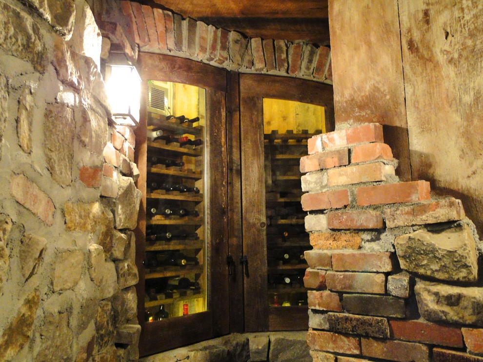 Inspiration for a traditional wine cellar in Denver with slate flooring and storage racks.
