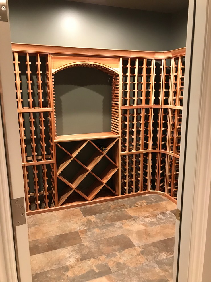 Wine cellar - mid-sized rustic wine cellar idea in Salt Lake City with storage racks